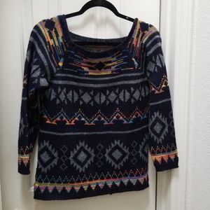 Blue sweater with rainbow pattern